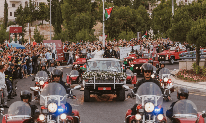 Jordan’s Crown Prince Hussein and Rajwa Al Saif travel in a motorcade on the day of their royal wedding, in Amman, Jordan, June 1, 2023. — Royal Hashemite Court via Reuters