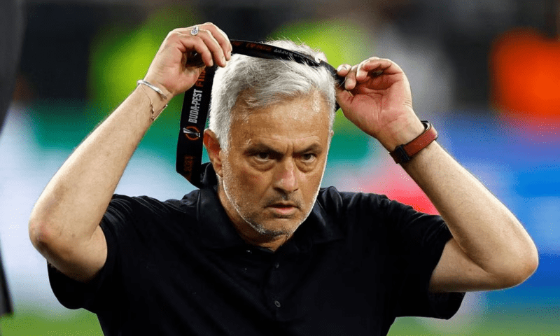 AS Roma coach Jose Mourinho takes off his runners-up medal during Europa League Final between Sevilla ans AS Roma at Puskas Arena, Budapest, Hungary on June 1. — Reuters