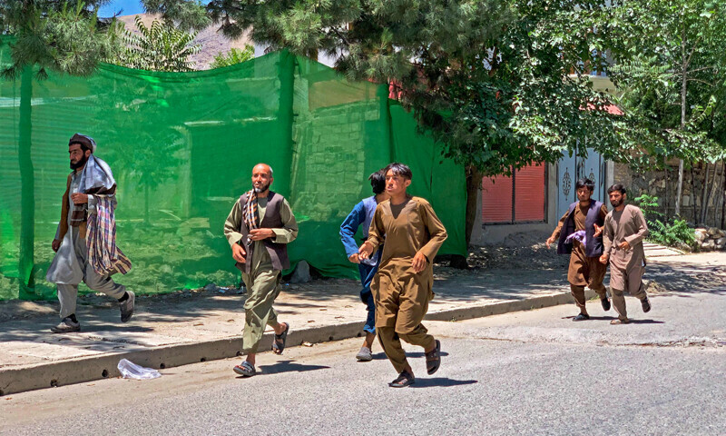 People run away after a bomb explosion during Fatiha prayers at the Nabawi mosque in the Hesa-e-Awal area of Fayzabad district in Afghanistan’s Badakhshan province on June 8, 2023. — AFP