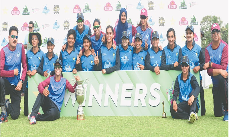 KARACHI: Dynamites players pose with the Pakistan Cup Women’s Cricket Tournament trophy after beating Challengers in the final at the State Bank Stadium on Sunday.—Tahir Jamal/White Star