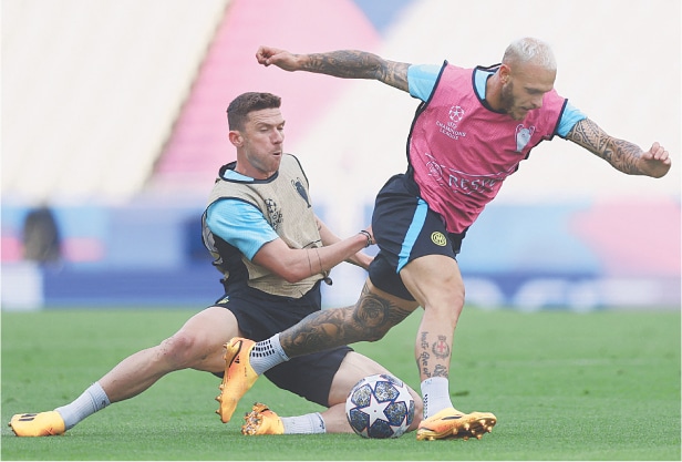 INTER Milan’s Robin Gosens (L) and Federico Dimarco attend a training session at the Ataturk Olympic Stadium on Friday.—Reuters