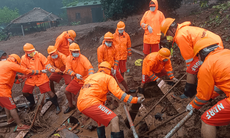 In this handout photograph released by India&rsquo;s National Disaster Response Force (NDRF) and taken on July 22, 2023, NDRF personnel search for victims at the site of a landslide at Irshalwadi village of Raigad district in Maharashtra state. &mdash; AFP