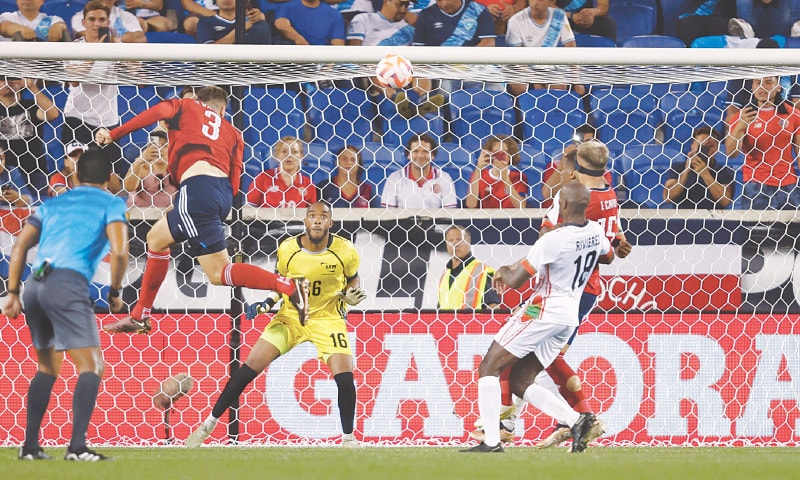 HARRISON (New Jersey); Costa Rica&rsquo;s Juan Pablo Vargas (L) heads to score during the CONCACAF Gold Cup Group &lsquo;C&rsquo; match against Martinique at the Red Bull Arena.&mdash;AFP