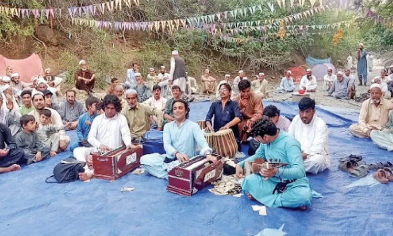 A local music band performs at a gathering in Landi Kotal during Eid days. — Dawn A local music band performs at a gathering in Landi Kotal during Eid days. — Dawn
