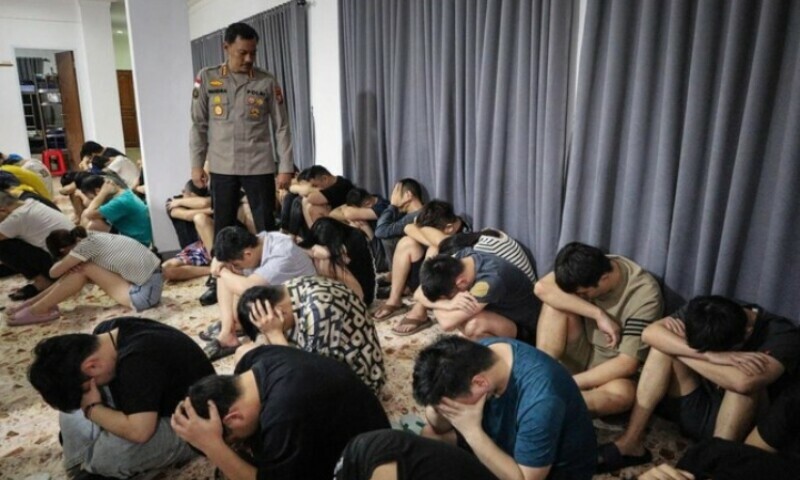 This picture taken on August 29, 2023 shows a group of Chinese nationals arrested on suspicion of running an online love scam syndicate that ensnared hundreds of victims in China, in Indonesia&rsquo;s Riau Islands province. &mdash; AFP