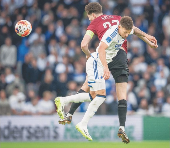 COPENHAGEN: Sparta Prague&rsquo;s Ladislav Krejci (L) and Copenhagen&rsquo;s Jordan Larsson vie for the ball during their Champions League third-round qualifier first-leg.&mdash;AFP