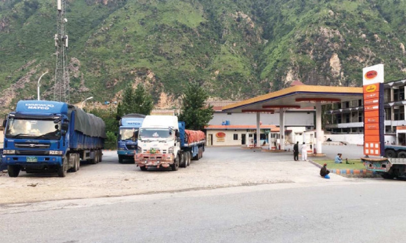 Natco trucks parked near a filling station in Bisham. — Dawn Natco trucks parked near a filling station in Bisham. — Dawn