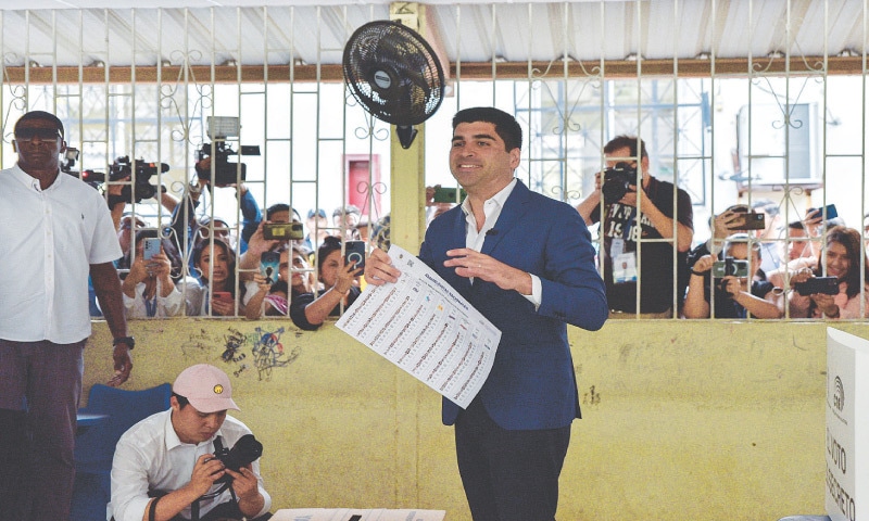 Ecuadorian presidential candidate Otto Sonnenholzner holds ballot papers at a polling station in Guayaquil, on Sunday. &mdash; Reuters