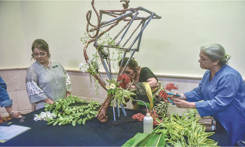 Past and present presidents of the Gardenia Chapter prepare an arrangement.
&mdash;Fahim Siddiqi / White Star