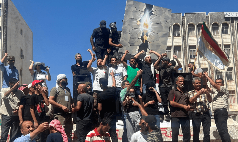 People protest in the Syria’s southern city of Sweida on September 1. — AFP