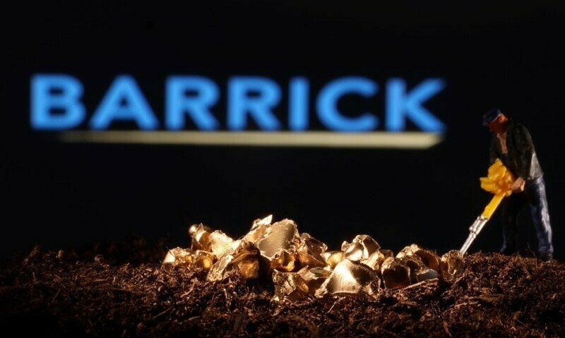 A small toy figure and gold imitation are seen in front of the Barrick logo in this illustration. — Reuters/File A small toy figure and gold imitation are seen in front of the Barrick logo in this illustration. — Reuters/File