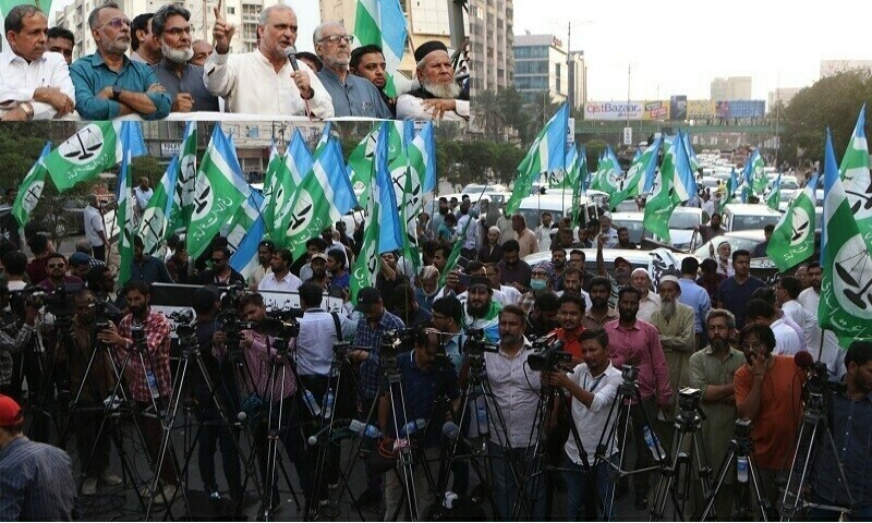 A picture released by the JI media department shows party leaders addressing media at Karachi’s Sharea Faisal on Tuesday. — JI