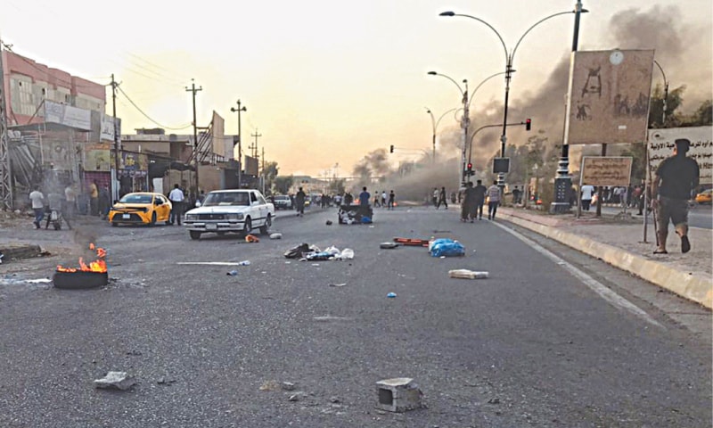 Protesters block a road following protests in the multi-ethnic Iraqi city of Kirkuk.—AFP Protesters block a road following protests in the multi-ethnic Iraqi city of Kirkuk.—AFP