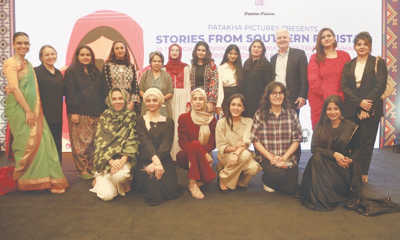 Young filmmakers from Sindh and Balochistan, along with Oscar-winning director Sharmeen Obaid-Chinoy and US Consul General Conrad Tribble, pose for a photograph on Friday.—Shakil Adil / White Star