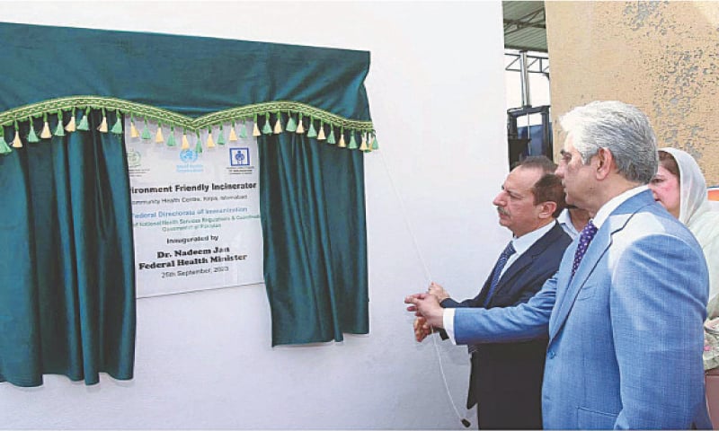 Interim Health Minister Dr Nadeem Jan inaugurates the environment-friendly incinerator at the community health centre in Kirpa on Monday. — APP