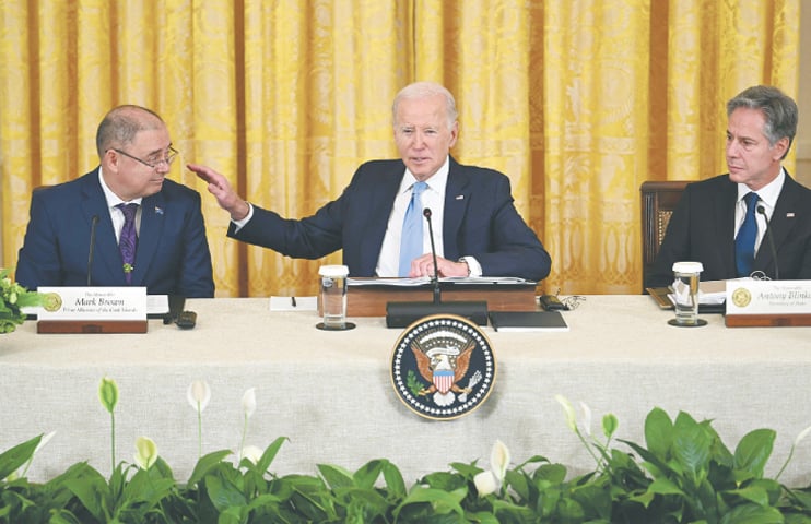 US SECRETARY of State Antony Blinken (right) looks on as President Joe Biden gestures to Cook Islands Prime Minister Mark Brown during the Pacific Islands Forum summit, on Monday.—AFP