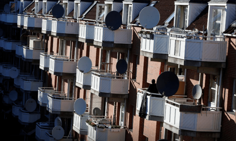  A woman stands on a terrace in Mjolnerparken, a housing estate that features on the Danish government’s “Ghetto List”, in Copenhagen, Denmark on May 8, 2018. — Reuters/File