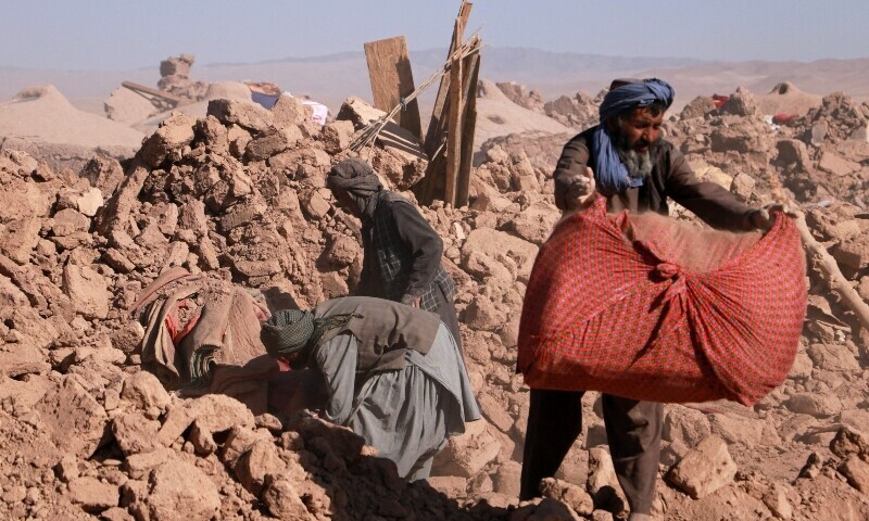 Afghan residents clear debris of damaged houses after earthquake in Nayeb Rafi village, Zendeh Jan district of Herat province on October 10, 2023. &mdash; AFP