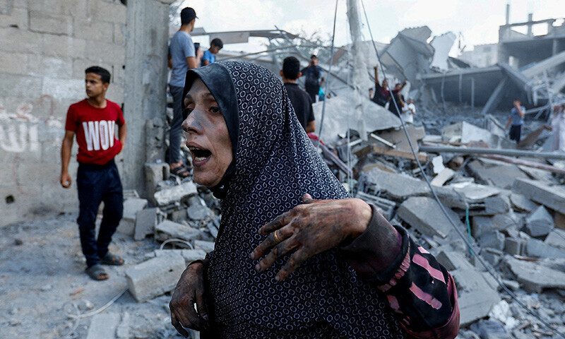 A Palestinian woman reacts at the site of Israeli strikes on houses, in Rafah in the southern Gaza Strip October 17, 2023.&mdash;Reuters/Ibraheem Abu Mustafa