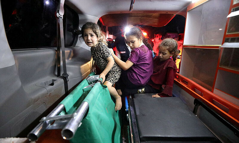  Children sit in the back of an ambulance after an Israeli air strike hit At Al-Ahli Hospital, according to Gaza Health Ministry in Gaza City, Gaza Strip. &mdash; Reuters 