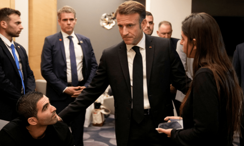 Macron meets Israeli-French nationals and hostages&rsquo; families at the Ben Gurion airport. &mdash; Reuters