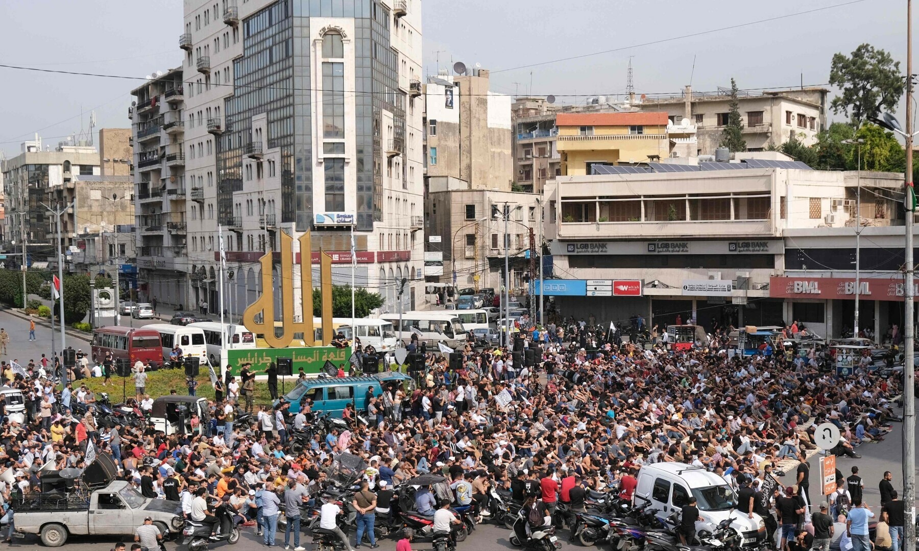  Mainly Muslim worshippers gather in support of the Palestinian people following Friday noon prayers at Nour Square in the northern city of Tripoli on October 27. &mdash; AFP 