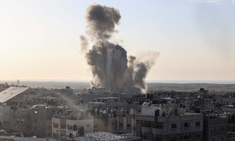  Smoke and dust rise following an Israeli air strike in Rafah, in the southern Gaza Strip on October 30. &mdash; AFP 