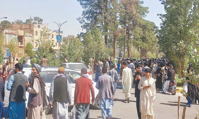 People rush out of buildings and gather on the streets after a quake jolted Herat on Saturday.&mdash;AFP
