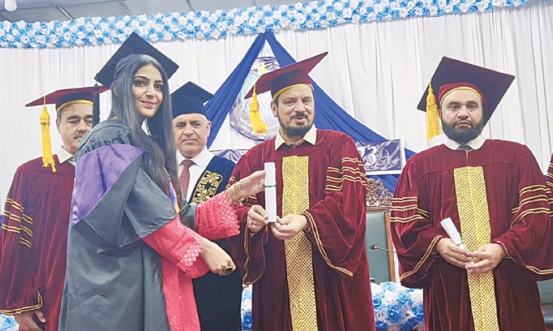 KP Governor Haji Ghulam Ali awards degree to a graduating student during the convocation of Saidu Medical Collage, Swat, on Saturday. — Dawn KP Governor Haji Ghulam Ali awards degree to a graduating student during the convocation of Saidu Medical Collage, Swat, on Saturday. — Dawn