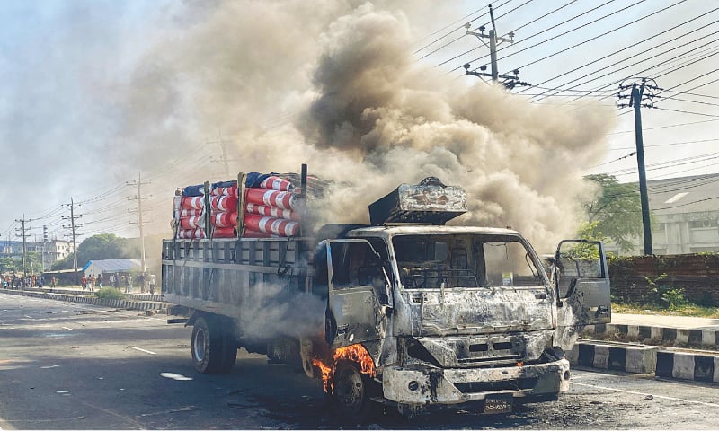 A CARGO truck burns on the street after it was torched by garment workers in Shafipur, Bangladesh.&mdash;AFP