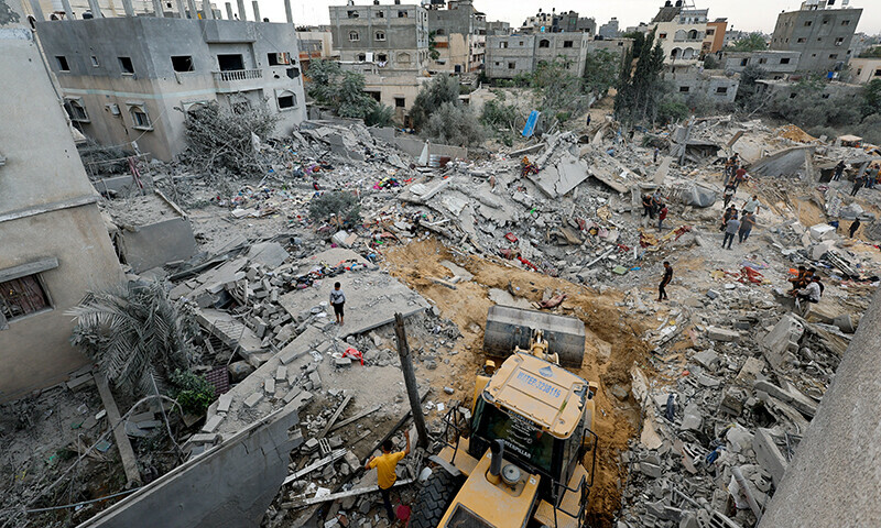 Palestinians gather at the site of an Israeli strike, amid Israel&rsquo;s bombardment of Gaza, in Khan Younis in the southern Gaza Strip November 12, 2023.&mdash;Reuterss