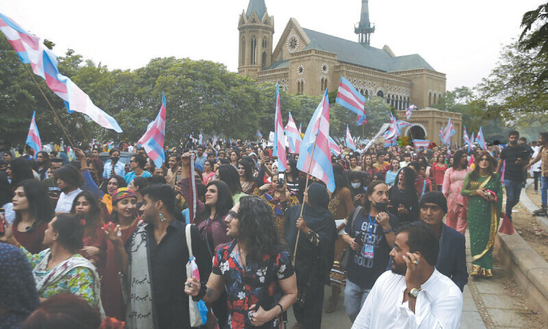 Waving transgender flags, supporters and members of the community participate in a walk outside Frere Hall on Sunday.—Shakil Adil/ White Star