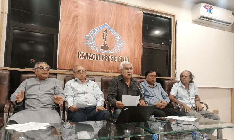 Fahim Zaman (centre) addresses the media during the press conference on Monday. — Photo by the author.