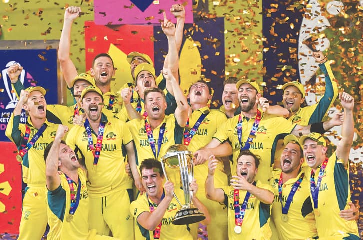  Australian players celebrate with the trophy after winning the ICC Cricket World Cup 2023 at the Narendra Modi Stadium in Ahmedabad, on Sunday.—AFP 