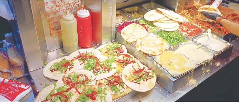 It takes several condiments to put together their famed shawarma Photography by Syed Zubairuddin Shah