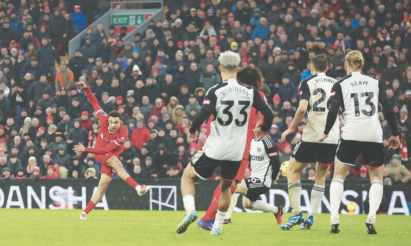 LIVERPOOL: Trent Alexander-Arnold (L) of Liverpool shoots to score the winner during the Premier League match against Fulham at Anfield on Sunday.&mdash;Reuters