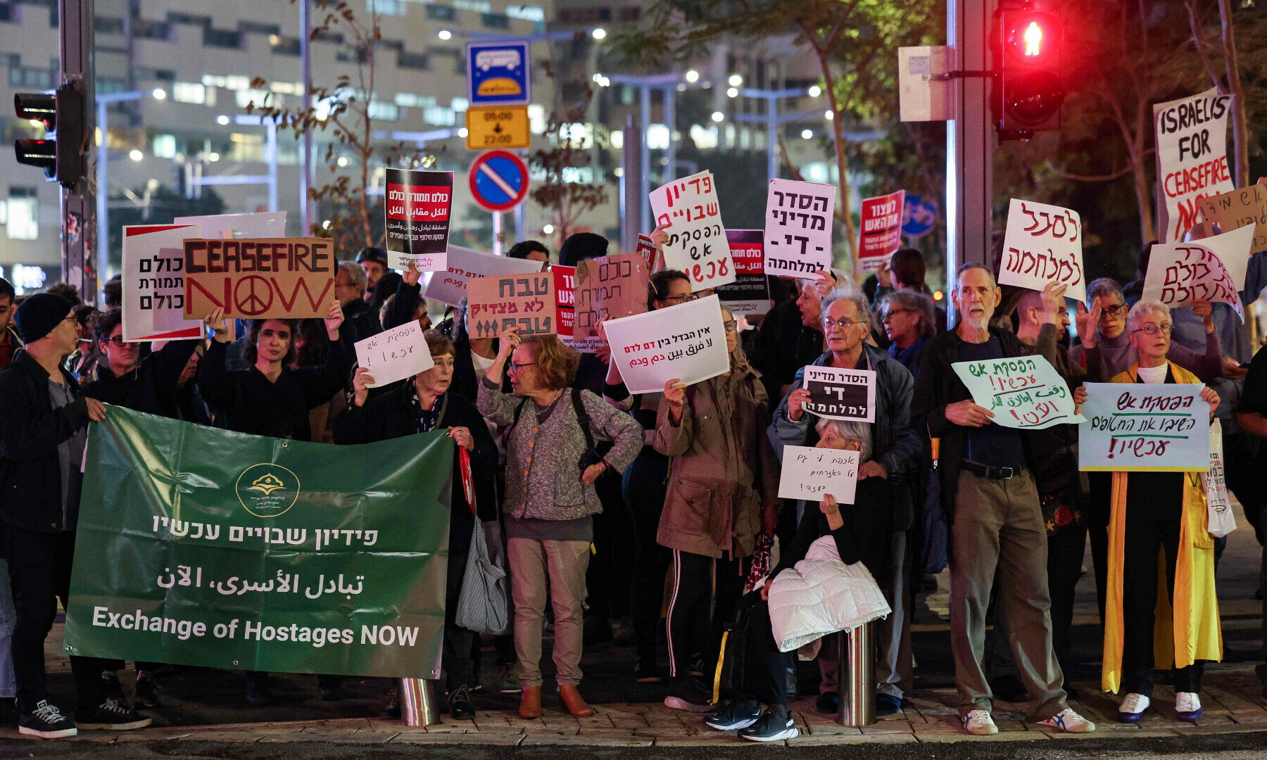 Israeli left-wing activists hold a demonstration near the Ministry of Defence in Tel Aviv on Dec 5, 2023, calling for a ceasefire and exchange of hostages. — AFP
