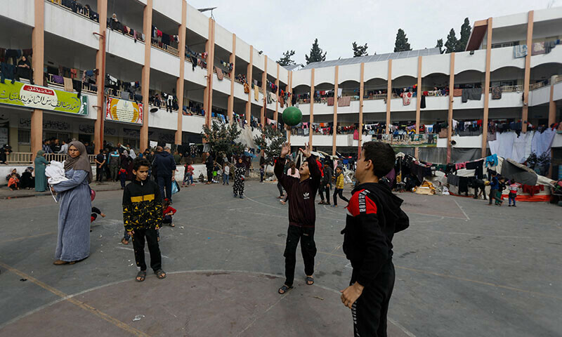 Children play at a school sheltering people who fled their houses due to Israeli strikes, in Rafah in the southern Gaza Strip, December 7, 2023. &mdash; Reuters