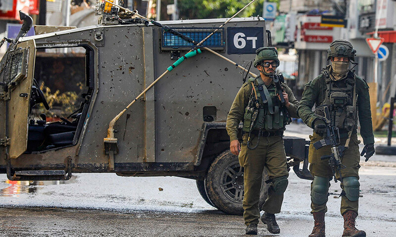 Israeli soldiers patrol on December 13 following an overnight army raid in Jenin in the occupied West Bank. &mdash; AFP