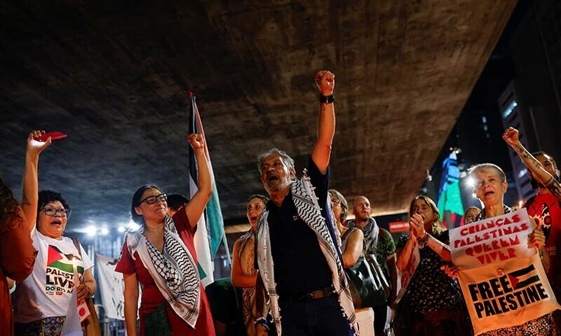 People gesture and shout during a vigil in tribute to Palestinians children in Gaza, in Brazil on December 15, 2023 &mdash; Reuters
