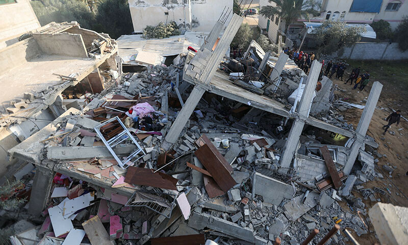 Palestinians inspect the site of an Israeli strike on a house, amid the ongoing Israeli bombardment in Rafah in the southern Gaza Strip, December 17, 2023.&mdash;Reuters