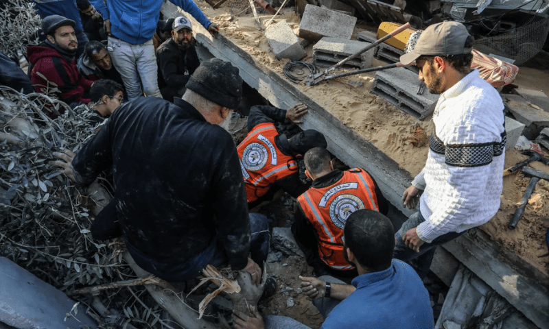 Civil defence teams carry out search and rescue operations amid the debris of destroyed buildings following an Israeli air raid in Rafah. &mdash;  Anadolu Agency