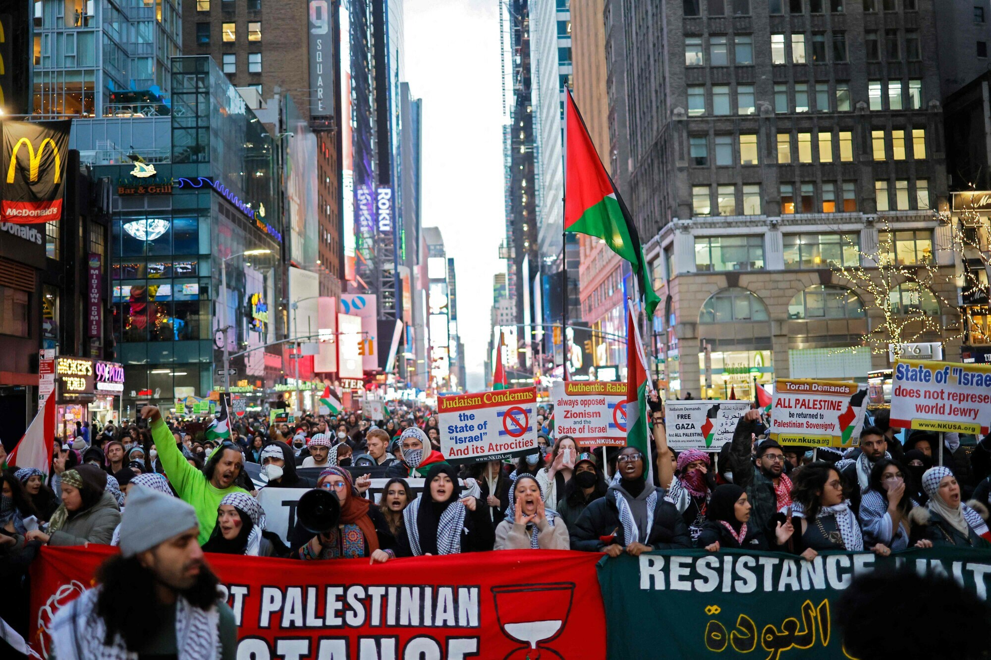 Pro-Palestine activists march as they participate in a Global Strike for Gaza on December 18, 2023 in New York City, New York. &mdash; AFP