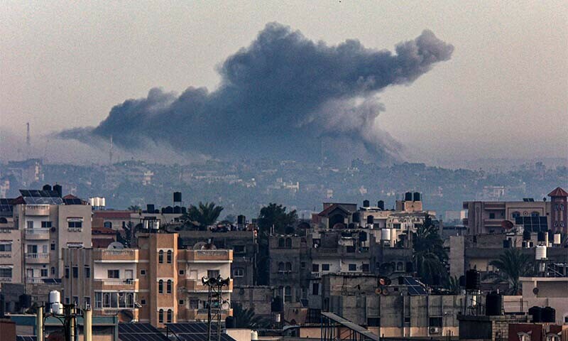 Smoke rises over Khan Younis in the southern Gaza Strip during Israeli bombardment as seen from Rafah on December 20, 2023. &mdash; AFP