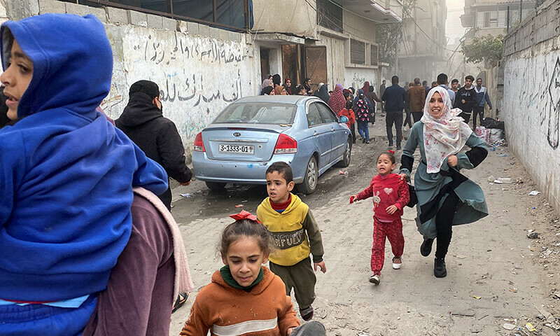 Palestinians react, at the site of an Israeli strike, amid the ongoing Israeli bombardment in Rafah, in the southern Gaza Strip, December 20, 2023.&mdash;Reuters