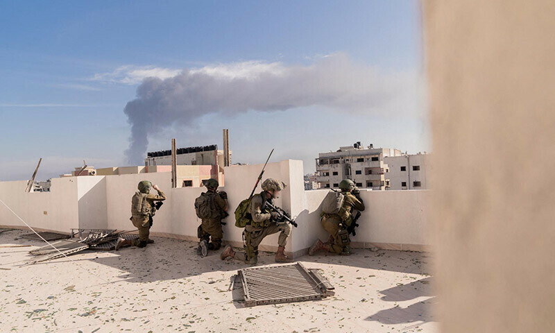 Israeli soldiers operate in the Gaza Strip on December 21, 2023. &mdash; AFP