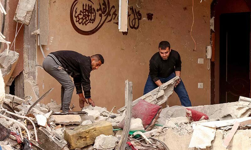 Palestinians check the rubble following Israeli bombardment in Khan Younis in the southern Gaza Strip on December 21, 2023&mdash; AFP