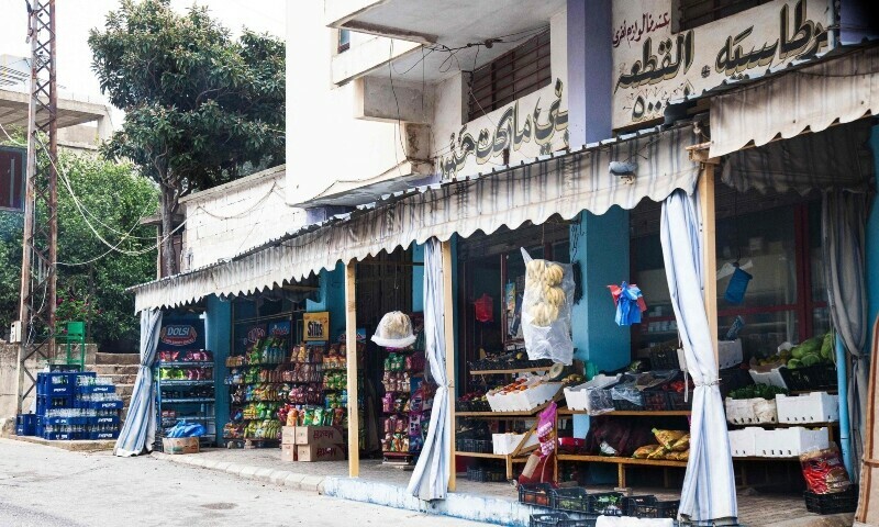 This picture shows a grocery store that remained open in the village of Kfar Kila near the border with Israel, on December 21, 2023.&mdash;AFP