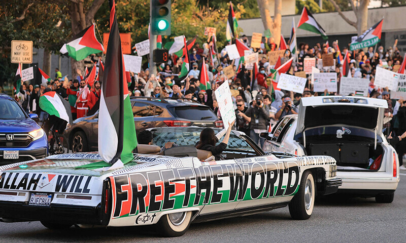 Protesters rally during the &ldquo;Black &amp; Palestinian Solidarity for a Ceasefire this Xmas&rdquo; by the Beverly Center shopping centre in Los Angeles on December 23, 2023.&mdash;AFP