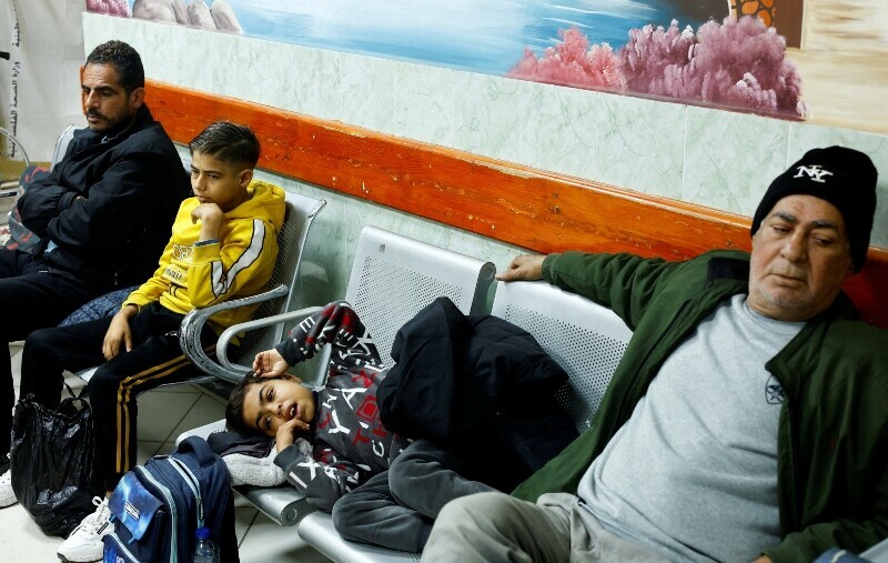 Palestinian boy Naseem Mohra, a 10-year-old kidney patient from northern Gaza who fled south with his family when Israel began the ground assault against Hamas and was separated from his mother, waits to undergo kidney dialysis at a hospital in Rafah in the southern Gaza Strip, December 24. &mdash; Reuters